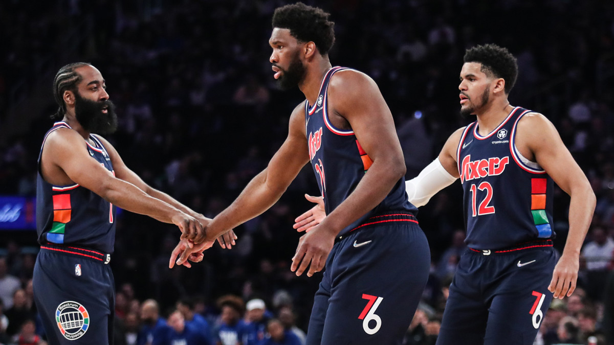 Philadelphia 76ers guard James Harden (1), center Joel Embiid (21) and forward Tobias Harris (12).